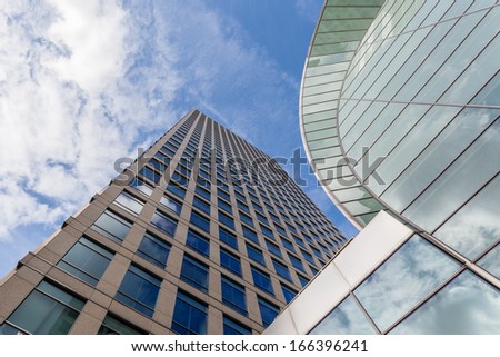Upward View Of Two Skyscrapers Of Different Materials, London
