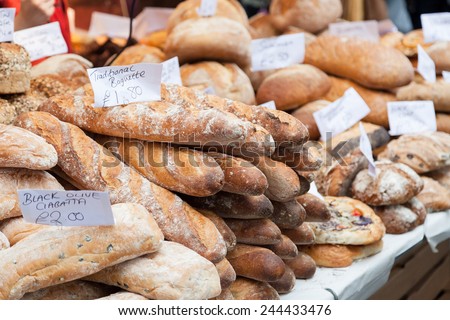 Various types of bread for sale on a market stall in a typical market