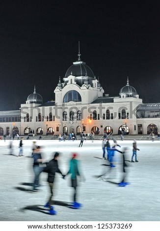 BUDAPEST - DECEMBER 13:Ice skaters in City Park Ice Rink on December 13, 2012 in Budapest, Hungary. Opened in 1870, it is the largest and one of the oldest ice rinks in Europe.