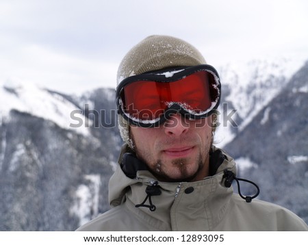 The snowy face of a snowboarder guy.