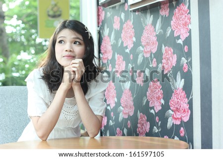 nice asian women portrait indoor sitting on the table