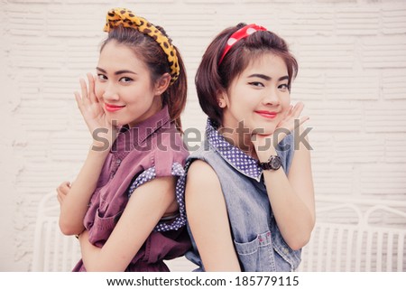 couple young pretty women in vintage retro clothe theme style