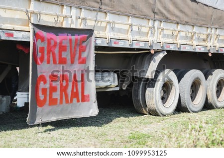 Trucker on strike. Side of a truck with a message written \