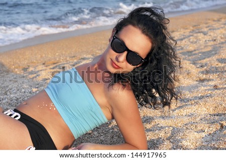 girl on the beach. rest on the sea clean sand seashells beautiful sunny mood