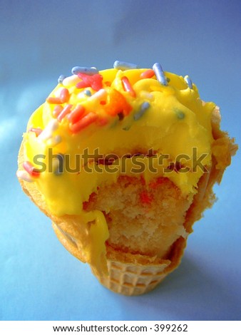 a half-eaten cake cone