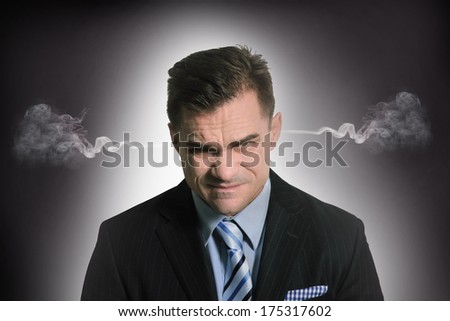 stress at work with businessman with smoke