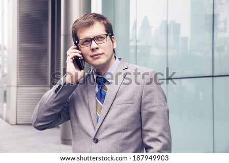 the businessman on the street talking on the phone