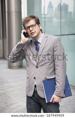 the businessman on the street talking on the phone