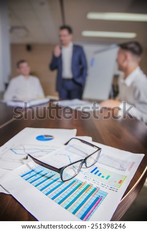 colleagues meeting to discuss their future financial plans only silhouettes being viewed