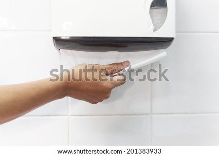 dirty hand picking a toilet paper