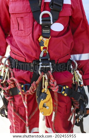 Inspector man wearing rope access equipment (portrait orientation and no cropped)