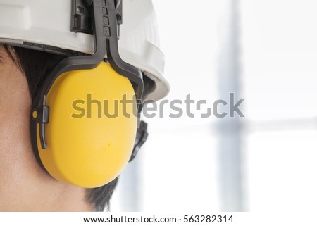 Man wearing safety helmet and hearing protection