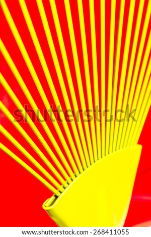 Yellow bars of iron rays on red background