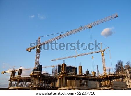 Industrial site with construction cranes