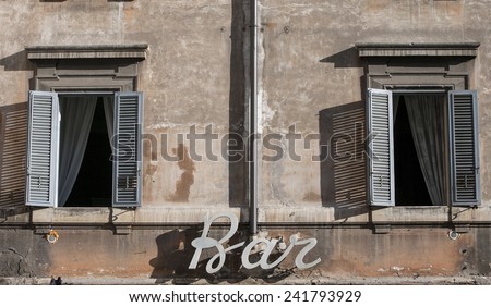 ROME, ITALY - JANUARY 2015, 04 :  Bar signboard and windows opened.  After days of unusual cold the sun shines back in Rome and temperatures are back to the average of this period of the year.