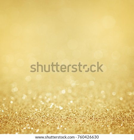 Lights on gold background. silver sparkle glitter bokeh abstract bright blur for merry christmas and happy new year celebration card decoration holiday art backdrop wallpaper