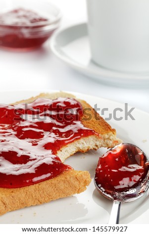 Toast with strawberry jam on a plate