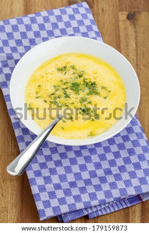 Beaten eggs with cress for scrambled eggs