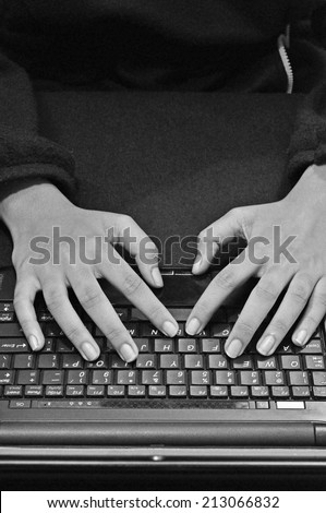 Girl working on the laptop, black and white