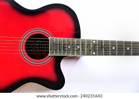 Strings of a red guitar on white background.
