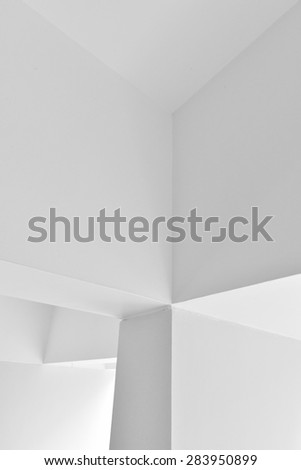Walls, corners and edges. Faces of walls meet at right angles to form interesting geometric abstract designs. Converging walls. Converging lines. Converging edges.\
Black and white High key image.