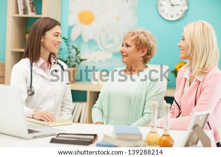 Mother and daughter with their family doctor.