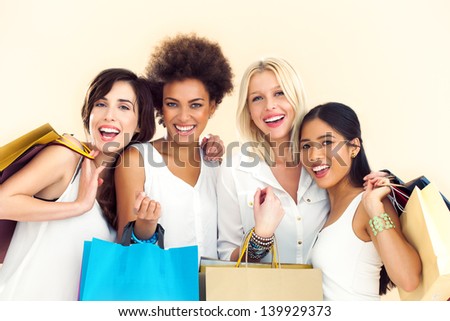Four different women sharing the passion for shopping.