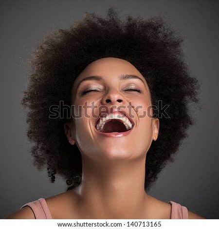 Portrait Of A Beautiful African Woman Laughing.