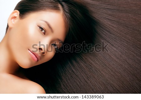 Beautiful Asian woman with gorgeous long brown hair.