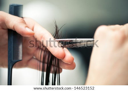 Hairdresser\'S Hands Cutting Hair.