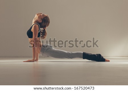 Woman in the Cobra yoga pose.