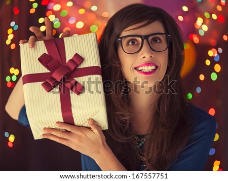 Young hipster woman happy about the present she got for birthday.