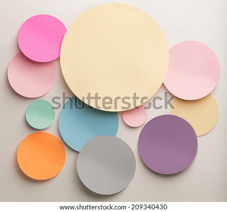 Indoor shot of paper cutout circles in various colours.