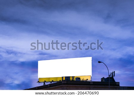Big, horizontal, white, blank, billboard on the roof.