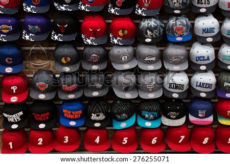 New York, USA - November 9, 2014. Team sport caps in one of the store on the Brodway St.