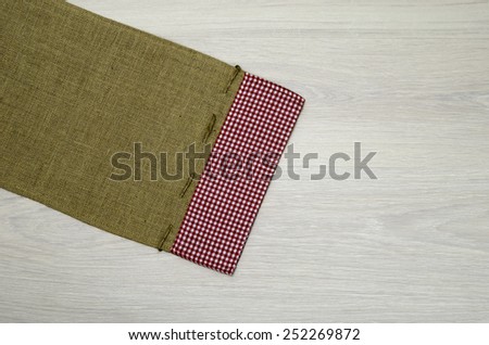 Burlap jute canvas vintage background on wooden boards / top-view photos of old sack cloth canvas with copy space