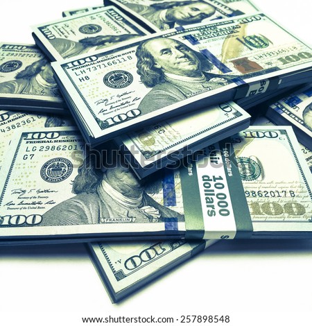 Creative business finance making money concept / Vintage retro effect filtered image of heap of new 100 (hundred) US dollars banknotes (bills) bundles close up - instagram effect