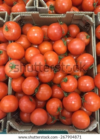Farmers market tomato in a cardboard fruit crates