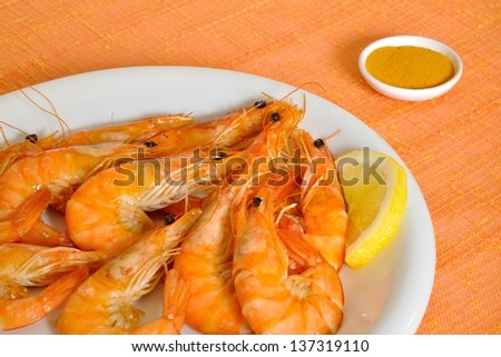 curry prawns on orange tablecloth