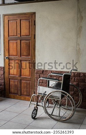 wheelchair and old door