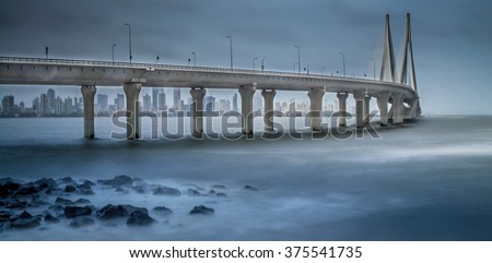 Worli Sea Link in Mumbai during Monsoon with slow shutter speed to capture motion blur. Cropped to create a more panoramic effect