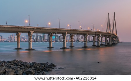 Sea Link in Mumbai, India during evening twilight (Slow shutter speed to create motion on water. Image has been cropped intentionally to create a slightly panoramic effect)