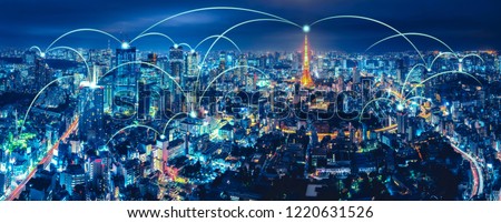 Wireless network and Connection technology concept with Tokyo city background at night in Japan, panorama view