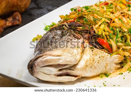 steamed fish, Thai style steamed fish in spicy sauce in white dish