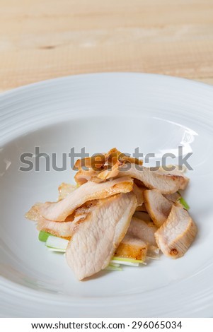 Charcoal boiled pork neck, grill pork Thai style food in white dish on wooden table