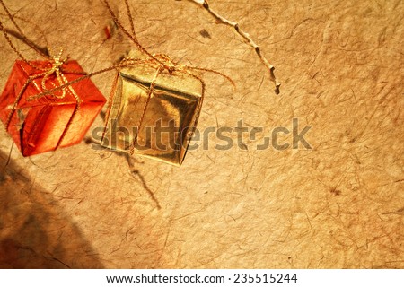 Christmas decorations on dried tree in mulberry paper texture style for background