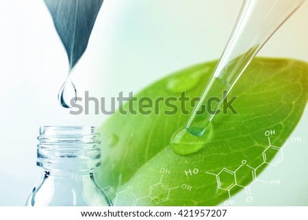 water drop from leaf and laboratory for natural chemistry concept