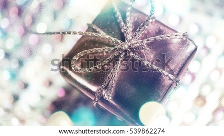 Presents and bokeh in blurred style on mulberry paper texture for christmas ans new year concept