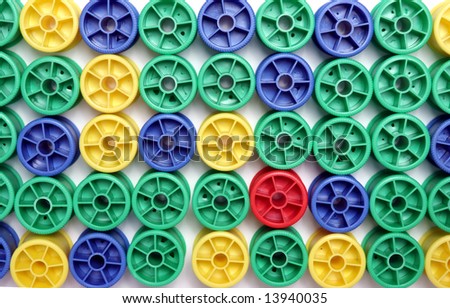 Many cotton reels on a white background