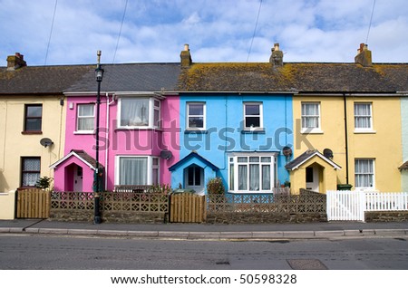 Row of brightly colored houses in a street
